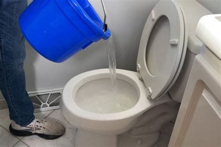 Can you unblock a toilet with hot water?