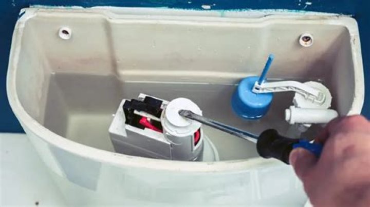 How do you adjust a flush tank?